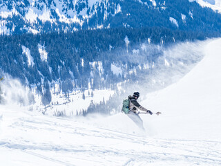 Backcountry snowboarding on the slopes of Mount Rainier