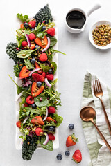 A crisp and juicy summer salad garnished with toasted pumpkin seeds.