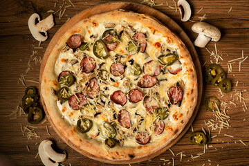 delicious pizza served on wooden table top view