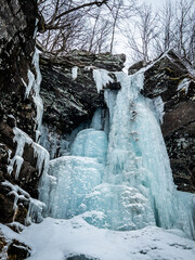 Frozen Kaaterskill Falls in winter Catskill mountains