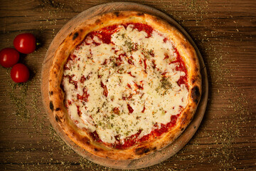 delicious margarita pizza served on wooden table top view