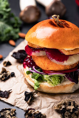 Burgers with fries and various sauces.