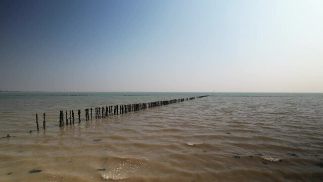 old fish traps posts in sea