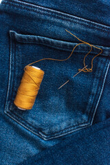 Concept of slow fashion: DIY care and repair of clothes.