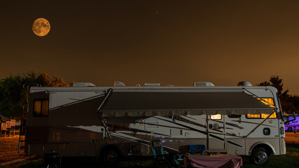 Camping under a full moon in a motorhome camper © Larry D Crain