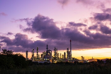Fototapeta na wymiar Oil​ refinery​ and​ plant and tower column of petrochemistry industry in pipeline oil​ and​ gas​ ​industry with​ sun orange sky the morning.