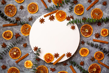 Flat lay composition of spices and dried fruits. Orange, cinnamon, star anise and eucalyptus sprigs...