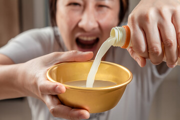 Asian women enjoying drinking makgeolli to celebrate. Makgeolli rice wine is a Korean fermented alcoholic beverage traditional drinks.