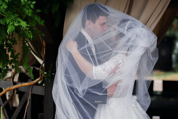 Cute wedding couple, happy bride and stylish groom.