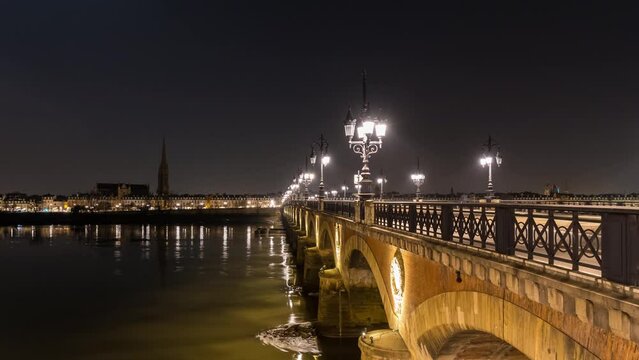Stone Bridge in Bordeaux at Night With Tramway and River