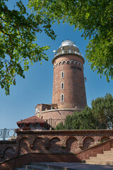  Leuchtturm der Stadt Kolobrzeg an der Küste der Ostsee in Polen - obrazy, fototapety, plakaty