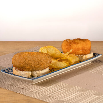 Spanish Ham And Mushroom Croquetas / Croquettes Served With Chips.