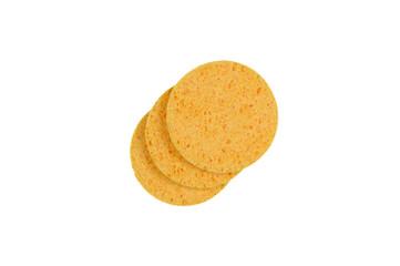 Three round yellow face sponges highlighted on a white background.