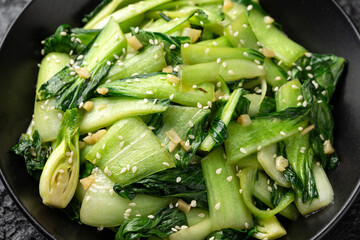 Chinese fried Pak Choi with garlic, sesame seeds. Healthy food