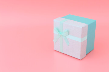 Pink color box on a beautiful pink background. Concept gifts and surprises. copyspace