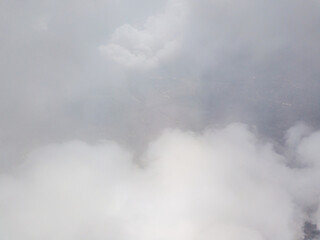 Fototapeta na wymiar High flying in the clouds. Aerial drone view.