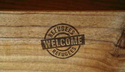 Refugees Welcome and help stamp and stamping