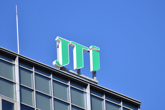 JTI Japan Tobacco International signage, logo, emblem on the facade of an international tobacco product manufacturer company. WARSAW, POLAND - MARCH 13, 2022