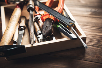 different construction tools on wooden background