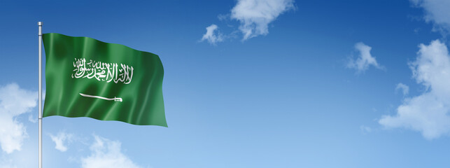 Saudi Arabia flag isolated on a blue sky. Horizontal banner