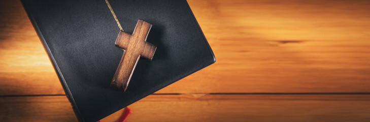 wooden Christian cross on holy Bible