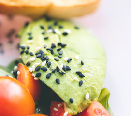 Scrambled eggs with bacon avocado and orange juice