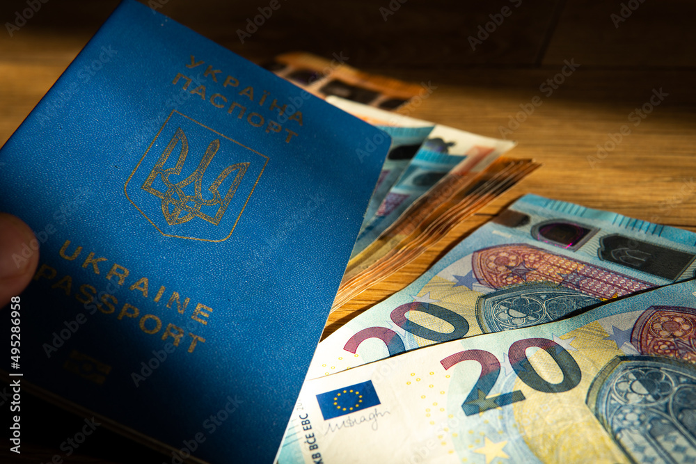 Wall mural Ukrainian passport on the background of the euro