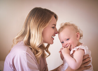 Nothing can replace this feeling. Shot of a young woman bonding with her baby girl at home.
