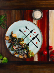 Salad with scallops. The concept of healthy eating. Salad with green beans, broccoli and scallop. Healthy lunch in a restaurant. Photo for publications, background, texture. Space for text. Close up.