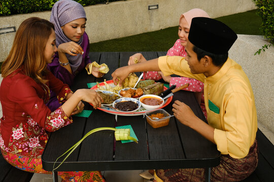 A picture of family having gathering during "Hari Raya Aidilfitri". Malay celebration for Eid Mubarak".