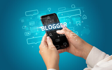 Hand using smartphone with social media concept