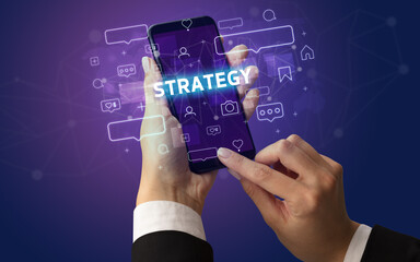 Hand using smartphone with social media concept