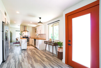 A minimalist white kitchen with wood details 