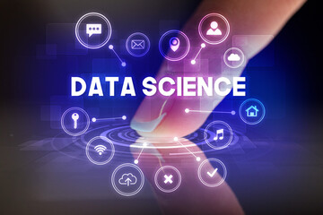 Finger touching tablet with web technology icons concept