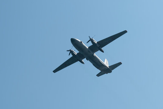 Russia, Sevastopol - July 21, 2021: Russian military transport twin-engined turboprop aircraft AN-26 (NATO reporting name: Curl) flies in the sky on rehearsal of Russian Navy Day parade.