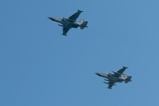 Russia, Sevastopol - July 21, 2021: Group of russian jet aircrafts Sukhoi Su-25 Grach (NATO reporting name: Frogfoot) flies in the sky in diagonal formation on rehearsal of Russian Navy Day parade.