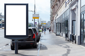 Vertical billboard for advertising and text. Sidewalk, shop windows. Mock-up.