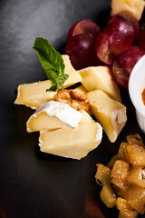 Cheese plate with camembert close up photo