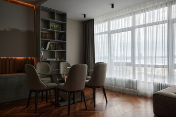 Naklejka na ściany i meble Modern interior of studio apartment in gray and brown colors and tones. chandeliers. Expensive and luxury design