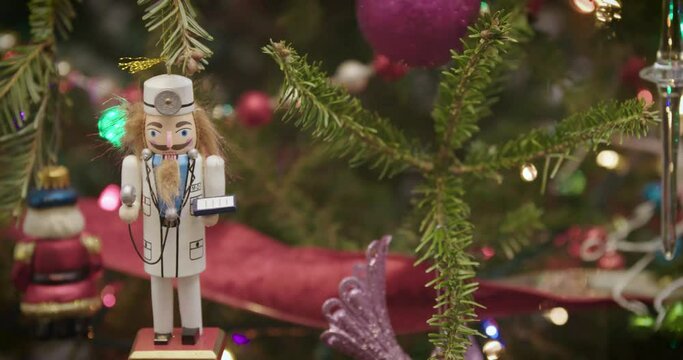 Christmas holiday tree ornaments medical doctor nutcracker pan left wide