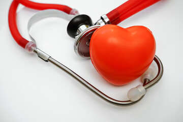 Stethoscope and red heart on white background, heart health, health insurance concept