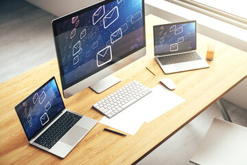 Modern computer monitor with postal envelopes hologram. Electronic mail and spam concept. 3D...