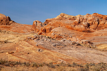 Overton, Nevada, USA - December 11, 2010: Valley of Fire. Slanted red-brown-yellow rock plateau...