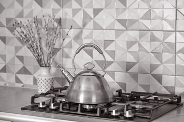 Kettle on a gas stove in the interior of the kitchen close-up