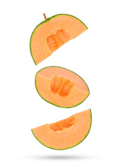 Fresh cantaloupe melon slices falling in the air isolated on white background.