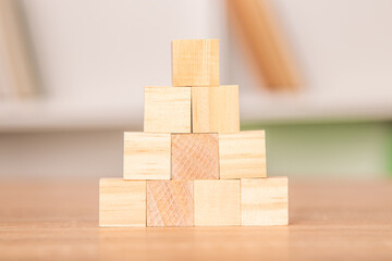 construction of stacked wooden blocks or cubes