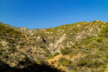 Sunny view of hiking in a rural trail of San Gabriel Mountains