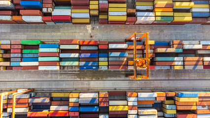Aerial view of shipping container port terminal. Colourful pattern of containers in harbor....