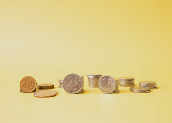 Russian rubles are stacked on a yellow background