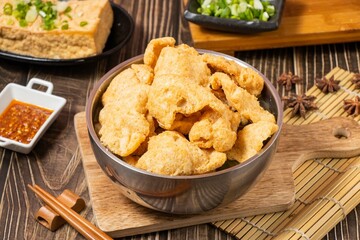fish crispy soup slats in a dish isolated on wooden board side view on table taiwan food